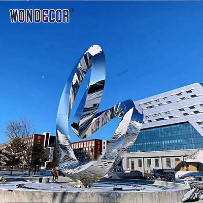 Large rotating stainless steel sculpture outdoor square park