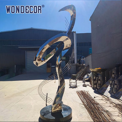 Large rotating stainless steel sculpture outdoor square park