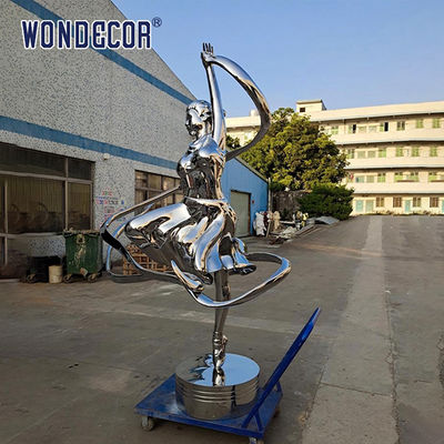 Large stainless steel character shaped outdoor sculpture in the park